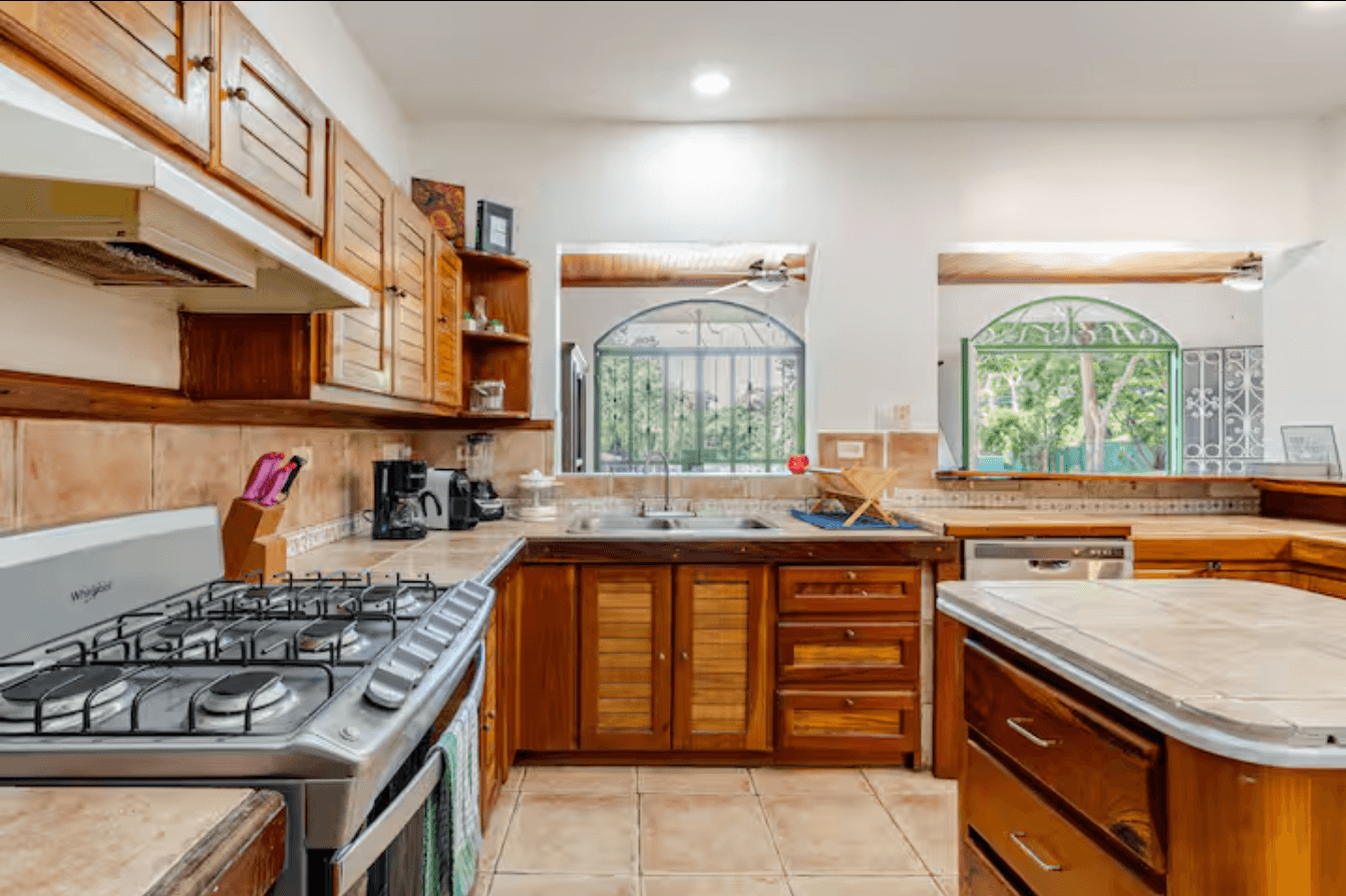 Fully equipped kitchen with quality cookware, spacious storage, and all the essentials to prepare family meals after a day of adventure in Guanacaste.