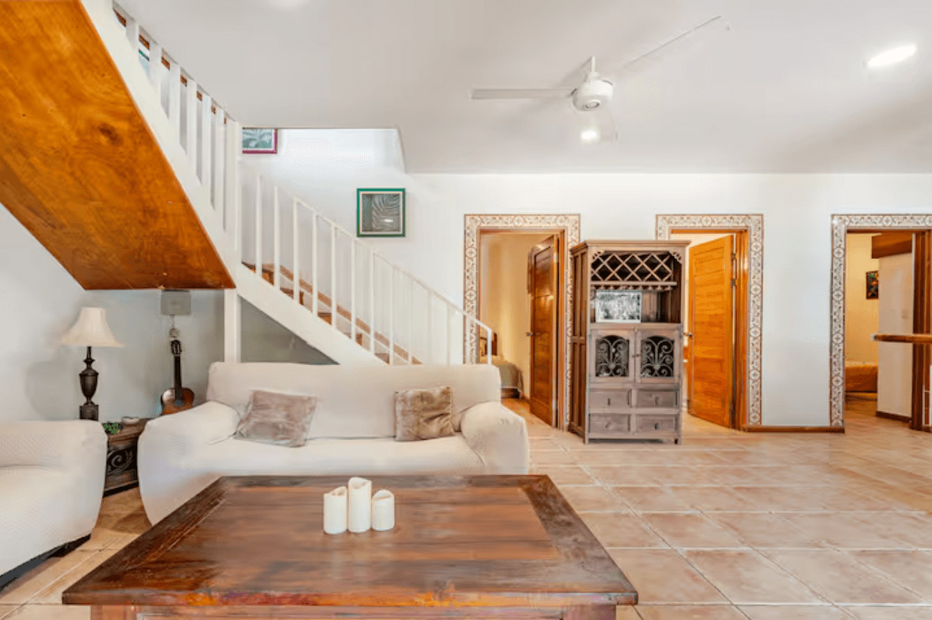 This spacious living area offers cozy sofas, natural light, and an open layout, creating the ideal space for sharing moments with family and friends.