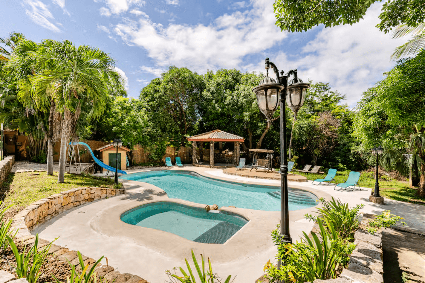 The large, curved pool offers plenty of space to swim, relax, and have fun with family or friends.