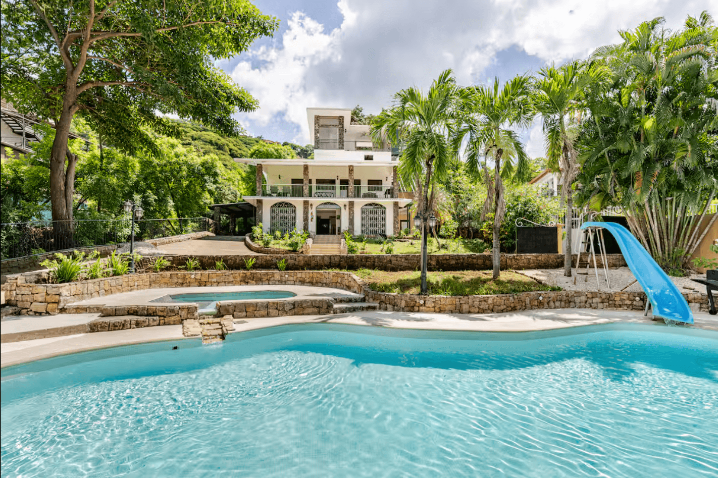 Nestled among lush greenery, Coco Brisas Lodge offers a peaceful environment surrounded by tropical trees and wildlife.