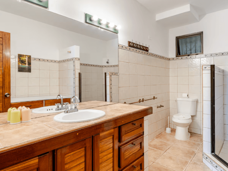 Large, bright bathroom featuring generous counter space, a powerful shower, and all the essentials for a comfortable stay.