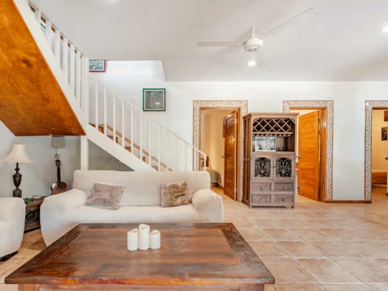 This spacious living area offers cozy sofas, natural light, and an open layout, creating the ideal space for sharing moments with family and friends.