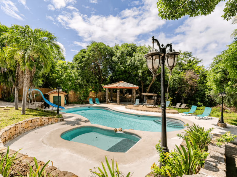 The large, curved pool offers plenty of space to swim, relax, and have fun with family or friends.
